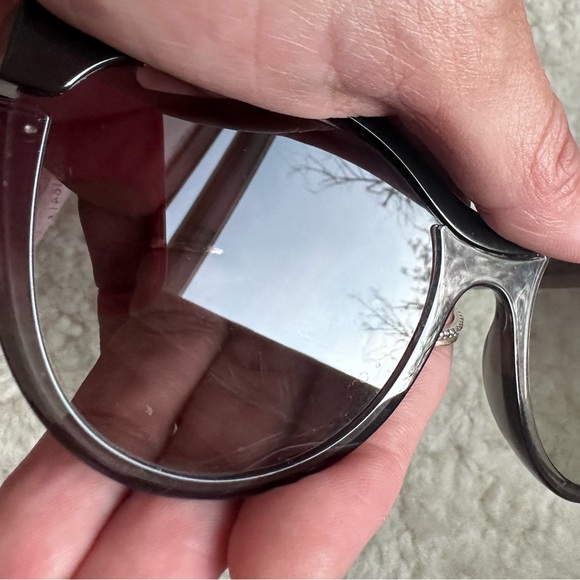 Miu Miu Cat Eye Cut-Out Sunglasses.